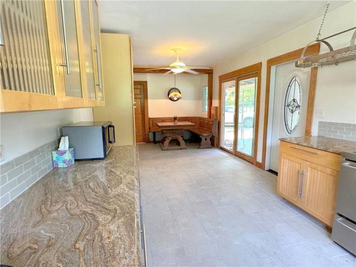 EFFICIENT LAYOUT: Looking towards the built-in dining cubby; the glass door to the right is to the huge 14'x7' Laundry/Pantry/Mud Room.