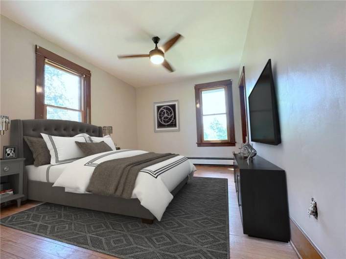 VIRTUALLY STAGED: This is the 15'x10' Bedroom #4 on the main level with original oak flooring and window frames, the closet is 11'x3'. This is right off of the Living Room and it could be used as a 1st floor Master Bedroom with a Full Bath a few steps away.