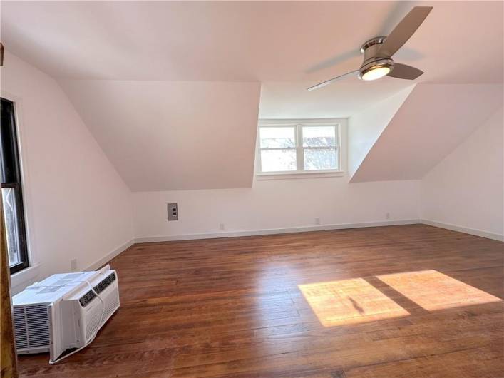 The same 23'x13' room without the staging, this is the original solid oak flooring from 1932, it was just refinished! The closet is being finished asap. This can be a Bedroom, game Room or Home office!